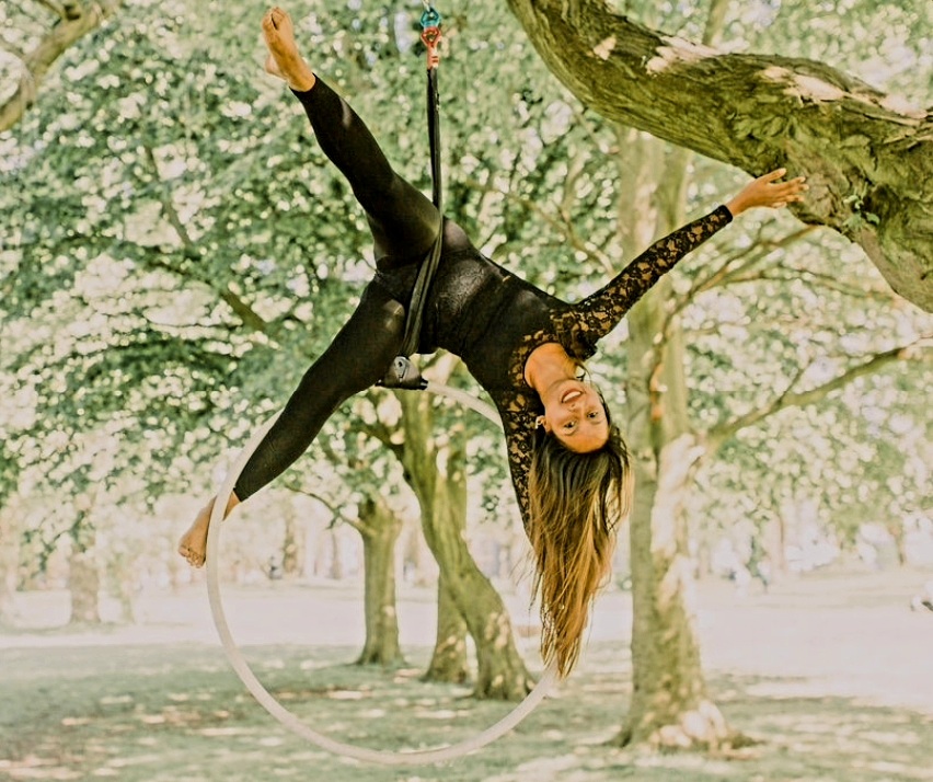 Niparun is pictured performing acrobatics with a hoop