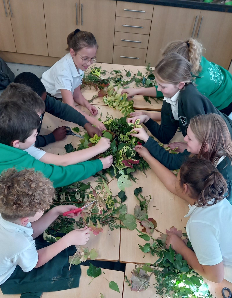 Pupils at Wistaston Academy make a living wreath for Remembrance Day