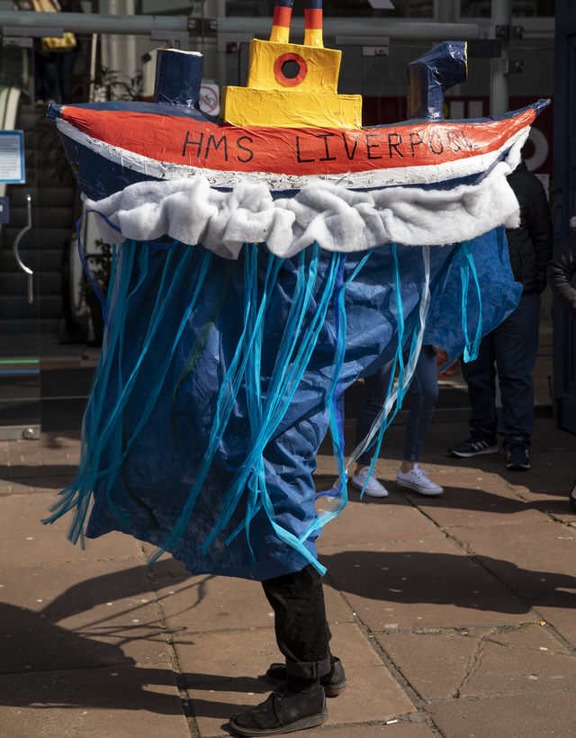 A person wears a ship outfit, which is labelled HMS Liverpool, at one of the Hope Happenings events for Hope Streets.