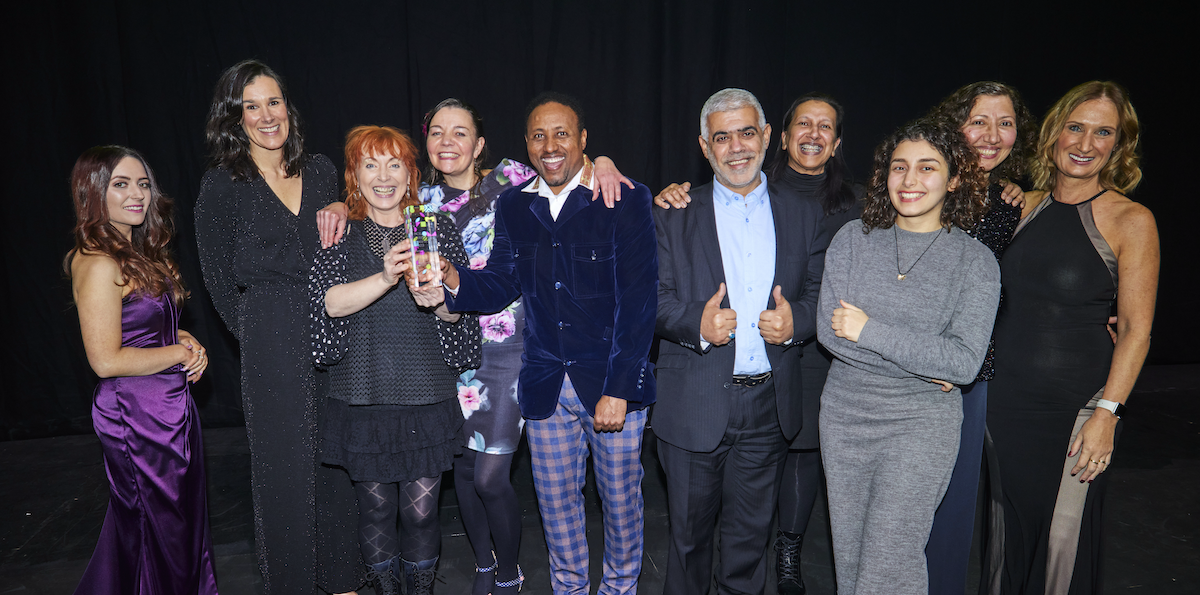 Curious Minds, Community Arts Northwest and participant artists from the Pushing Boundaries project accept their award at the Manchester Culture Awards 2023.accept their award